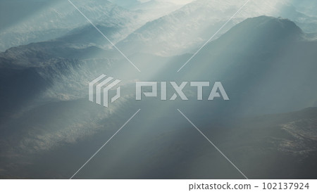 Alpine chains shrouded in the morning fog Alpine chains shrouded in the morning fog 102137924