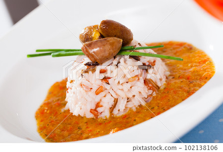 Delicious chicken heart with rice in a sea of hot tomato-cream sauce Delicious chicken heart with rice in a sea of hot tomato-cream sauce 102138106