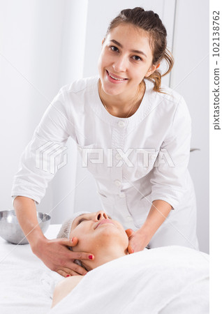 Mature woman having face massage 102138762