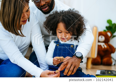 Happy family spending time and having activities together at home 102142041