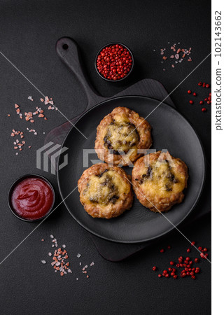 Delicious baked meat boats with mushrooms, cheese, salt and spices 102143662