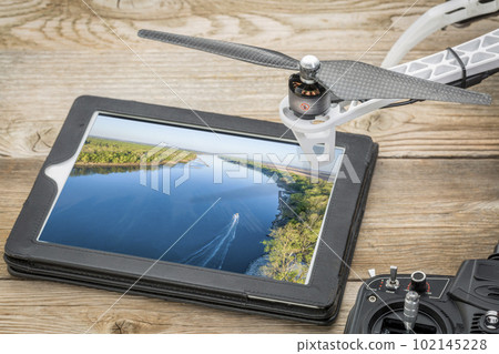 spring sunrise over the Missouri River with a fishing boat, aerial image displayed on a digital tablet spring sunrise over the Missouri River with a fishing boat, aerial image displayed on a digital tablet 102145228