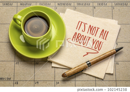 It is not all about you - reminder note to self, handwriting on a napkin with a cup of coffee, relationship and personal development concept 102145238