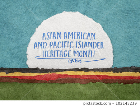 Asian American and Pacific Islander Heritage Month, May - handwriting on an art paper against abstract landscape, reminder of cultural event 102145239