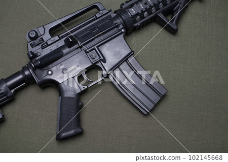 M4 assault rifle on olive drab canvas M4 assault rifle on olive drab canvas 102145668