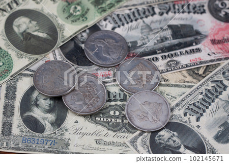 Old US banknotes and silver certificates with silver dollar coins Old US banknotes and silver certificates with silver dollar coins 102145671