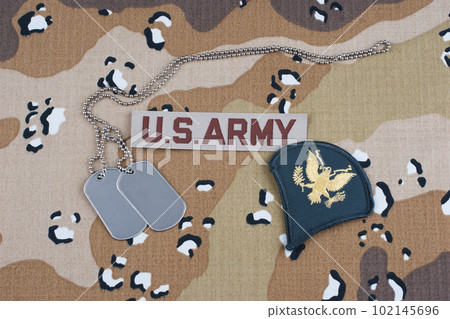 US ARMY specialist rank patch and dog tags on Desert Battle Dress Uniform 102145696