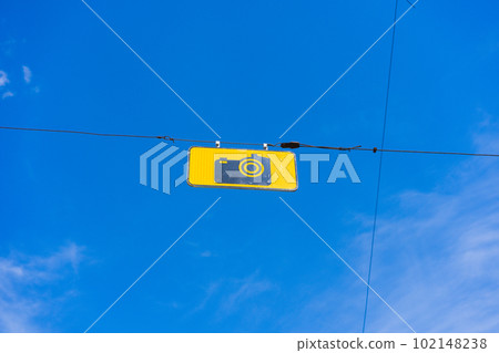 A road sign with the text "Photo Control" with blue sky on the background. A road sign with the text "Photo Control" with blue sky on the background. 102148238