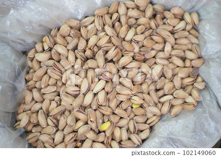 top view of pistachios nuts on in bowl  102149060