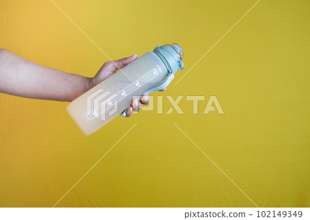 holding a water bottle close up holding a water bottle close up 102149349