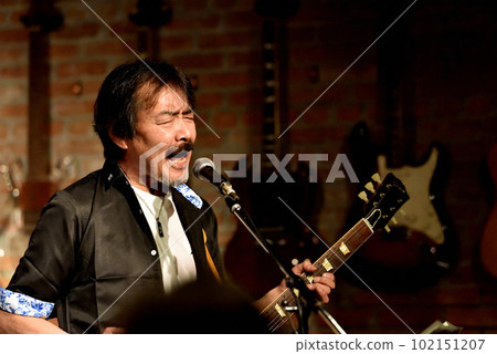 Vocals of a blues band performing at a live house Vocals of a blues band performing at a live house 102151207