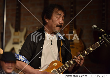 Vocals of a blues band performing at a live house Vocals of a blues band performing at a live house 102151216