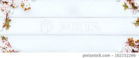 Easter eggs background. May flowers, white happy easter egg on wooden spring background. Easter card banner. Flat lay. Easter eggs background. May flowers, white happy easter egg on wooden spring background. Easter card banner. Flat lay. 102152266