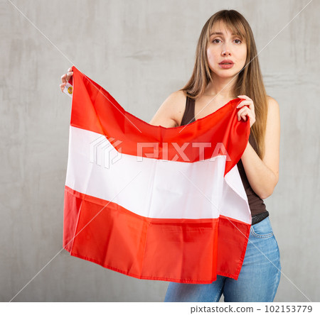 Frustrated woman holding flag of Austria. Fear and upset for mistake Frustrated woman holding flag of Austria. Fear and upset for mistake 102153779