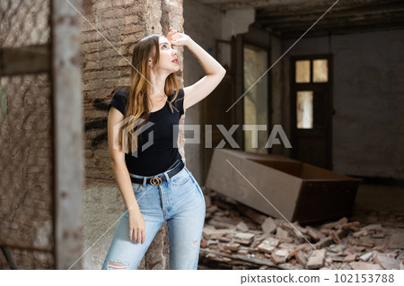 Portrait of attractive woman in abandoned building 102153788