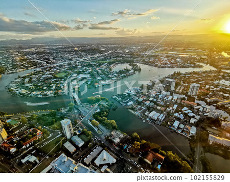 GOLD COAST, AUSTRALIA - APRIL 25, 2021 Bird eye view of mountain and river and high rise buildings 102155829