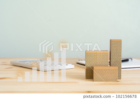 Image of real estate investment | Bar graph, apartment object, calculator and notebook 102156678