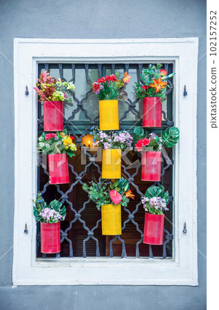 Flower pots hanging over window Flower pots hanging over window 102157252