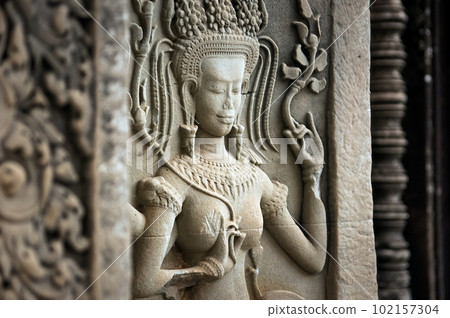 Female dancer carved in stone in Angkor Wat 102157304