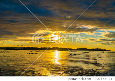 Matsushima, one of Japan's three most scenic spots, the first sunrise seen from a boat, the sunrise, the morning view, Matsushima-cho, Miyagi Prefecture Matsushima, one of Japan's three most scenic spots, the first sunrise seen from a boat, the sunrise, the morning view, Matsushima-cho, Miyagi Prefecture 102164044