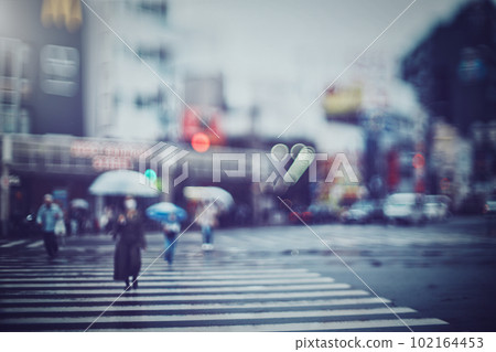 Pedestrian crossing and cityscape blur scenery on a rainy day 102164453