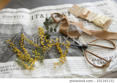 Mimosa arrangement and antique accessories 102165132