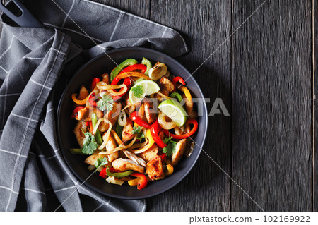 chicken fajitas with bell peppers, onion, spices chicken fajitas with bell peppers, onion, spices 102169922