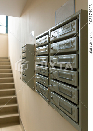 Steel Mailboxes in an apartment residential building. 102174068