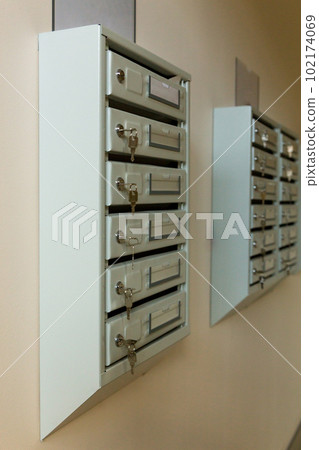 Steel Mailboxes in an apartment residential building. 102174069