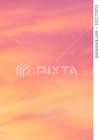 Sky with soft and fluffy pastel coral orange pink and blue colored clouds. Sunset background. Nature. sunrise. Instagram toned style Sky with soft and fluffy pastel coral orange pink and blue colored clouds. Sunset background. Nature. sunrise. Instagram toned style 102175051