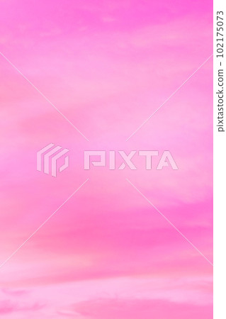 Sky with soft and fluffy pastel orange pink and blue colored clouds. Sunset background. Nature. sunrise. Vertical Sky with soft and fluffy pastel orange pink and blue colored clouds. Sunset background. Nature. sunrise. Vertical 102175073