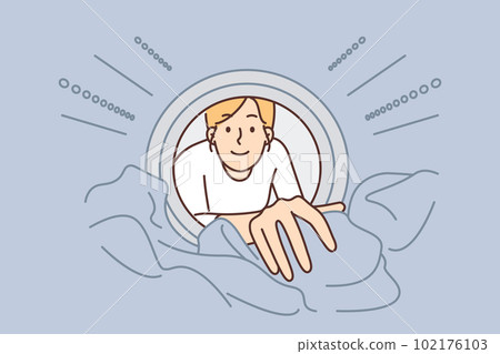 Woman looks into washing machine to get clean clothes while doing housework and taking care hygiene 102176103