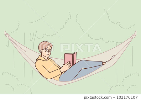 Man student in hammock reads book enjoy outdoor recreation in park with green trees 102176107