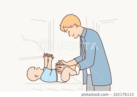 Father changes nappy baby lying on changing table and takes care of little newborn son 102176113