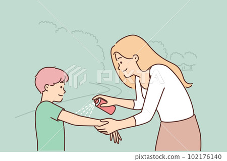 Woman spraying mosquito spray on boy hand taking care of preteen child health walking in park  102176140