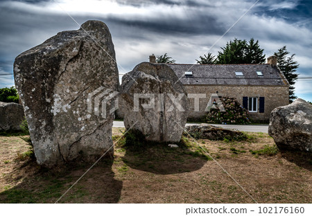 Ancient Stone Field Kerzerho Cruzuno With Neolithic Megaliths And Cottage Near Finistere Village Carnac In Brittany, France 102176160