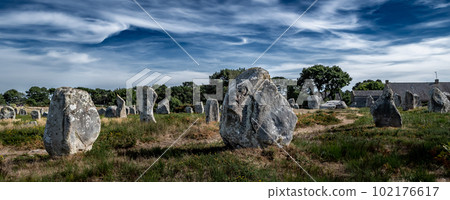 Ancient Stone Field Alignements De Menhir Carnac With Neolithic Megaliths And Old Cottage In Brittany, France 102176617