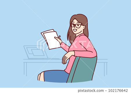 Successful woman office worker with papers and sits at table with laptop making career as accountant 102176642