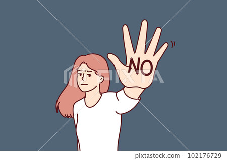 Brave woman makes stop gesture showing palm with inscription no to call for end to discrimination Brave woman makes stop gesture showing palm with inscription no to call for end to discrimination 102176729