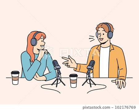Smiling people talk in microphones on radio live Smiling people talk in microphones on radio live 102176769
