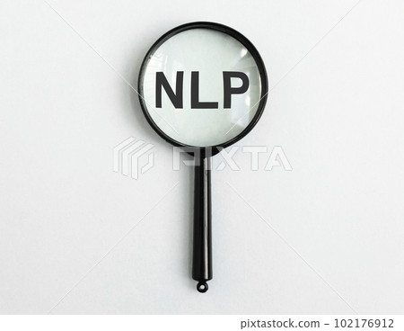 Neuro-linguistic programming, NLP acronym through magnifying glass lens, magnifier Neuro-linguistic programming, NLP acronym through magnifying glass lens, magnifier 102176912