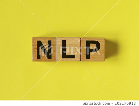 Neuro-linguistic programming, NLP acronym on wood cubes on yellow background Neuro-linguistic programming, NLP acronym on wood cubes on yellow background 102176918