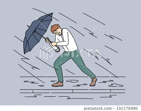Businessman with umbrella protect from storm  102176990