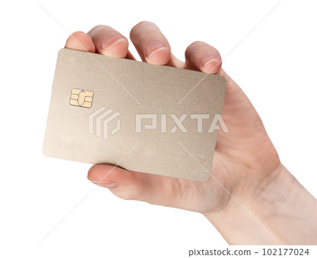 Bank credit card mock up in hand isolated on white background. Blank clean gold debit plastic bankcard with chip Bank credit card mock up in hand isolated on white background. Blank clean gold debit plastic bankcard with chip 102177024