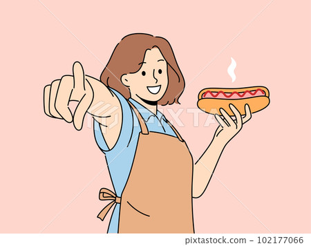 Smiling woman hold hot dog point at screen  102177066