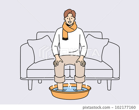 Smiling man soak feet in hot water Smiling man soak feet in hot water 102177160