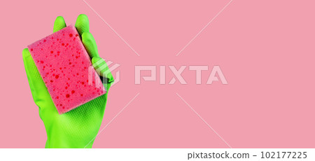 Pink sponge in hand in green glove on ad background, promotion banner design for professional cleaning service Pink sponge in hand in green glove on ad background, promotion banner design for professional cleaning service 102177225