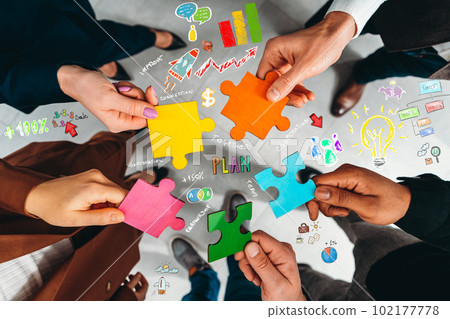 Teamwork of partners connect puzzle pieces as integration and startup 102177778
