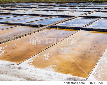 Traditional salt extraction camp with colored ponds, Aveiro, Portugal Traditional salt extraction camp with colored ponds, Aveiro, Portugal 102181585