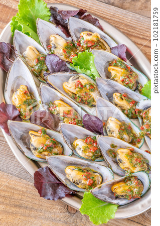 Baked half shell mussels Baked half shell mussels 102181759